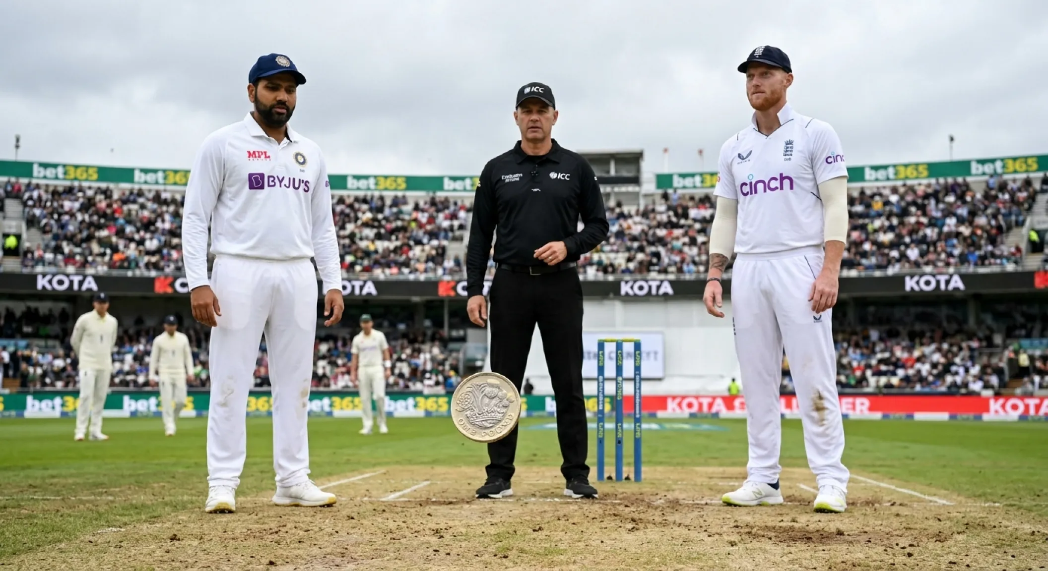 Cricket captain calling heads or tails during the coin toss at centre pitch