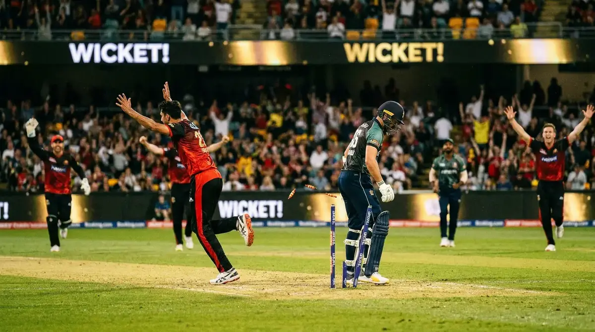 Cricket bowler celebrating a key wicket that shifts the momentum of the match