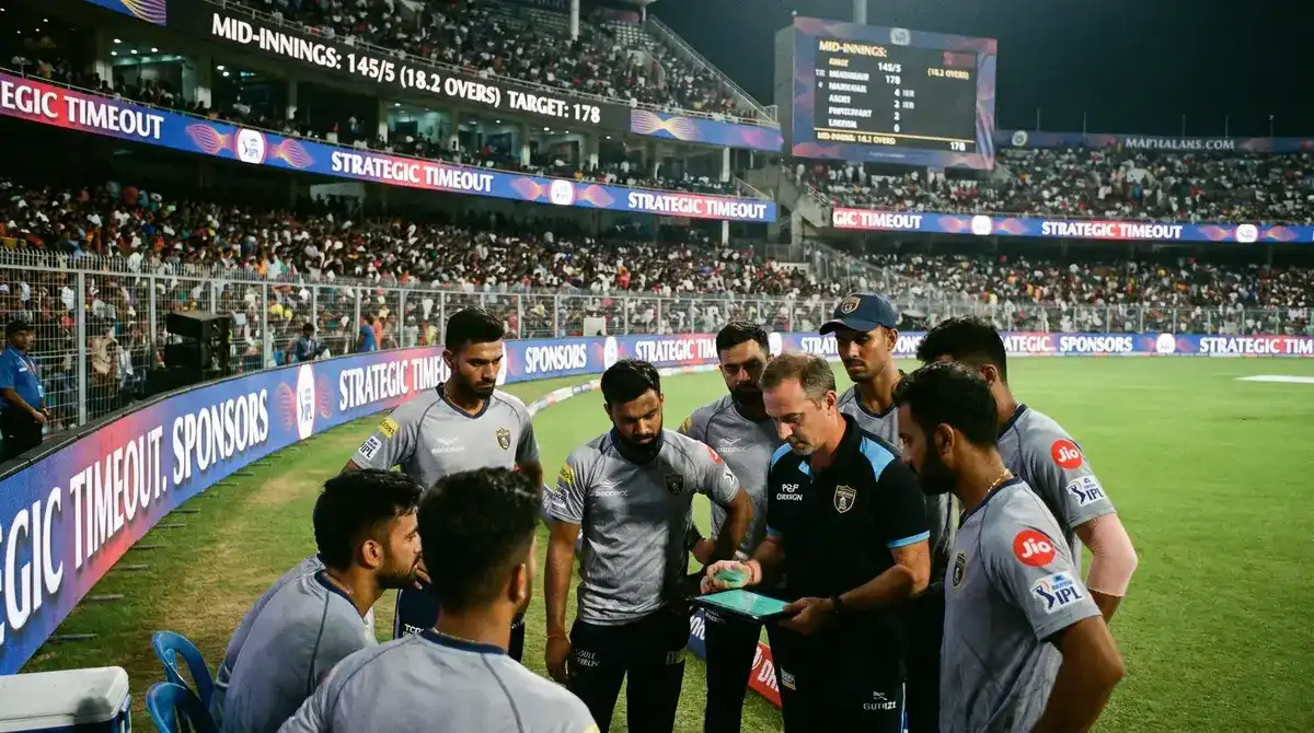 IPL strategic timeout with players gathered on the field and coaching staff reviewing tactics