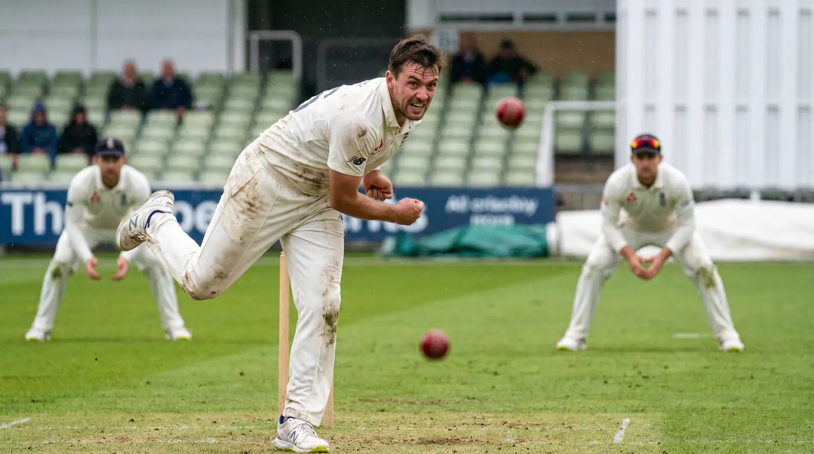 Seam bowler generating movement under overcast skies in a morning Test session in England