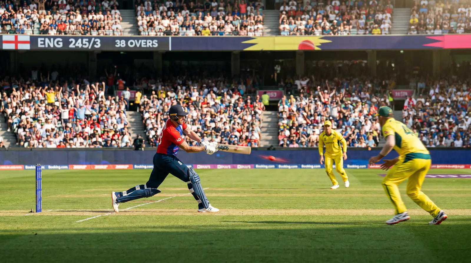 ODI cricket match scene with batsman driving through the covers at a packed ground