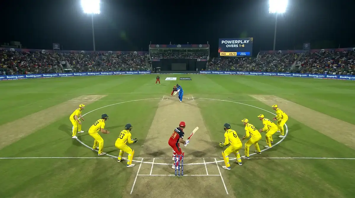 T20 cricket fielding setup during powerplay overs with close-in fielders surrounding the batsman